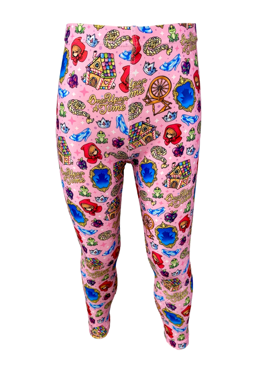 Baby pink leggings with fairy tale symbols. This includes gingerbread house, little red riding hood, glass slipper and the words once upon a time.